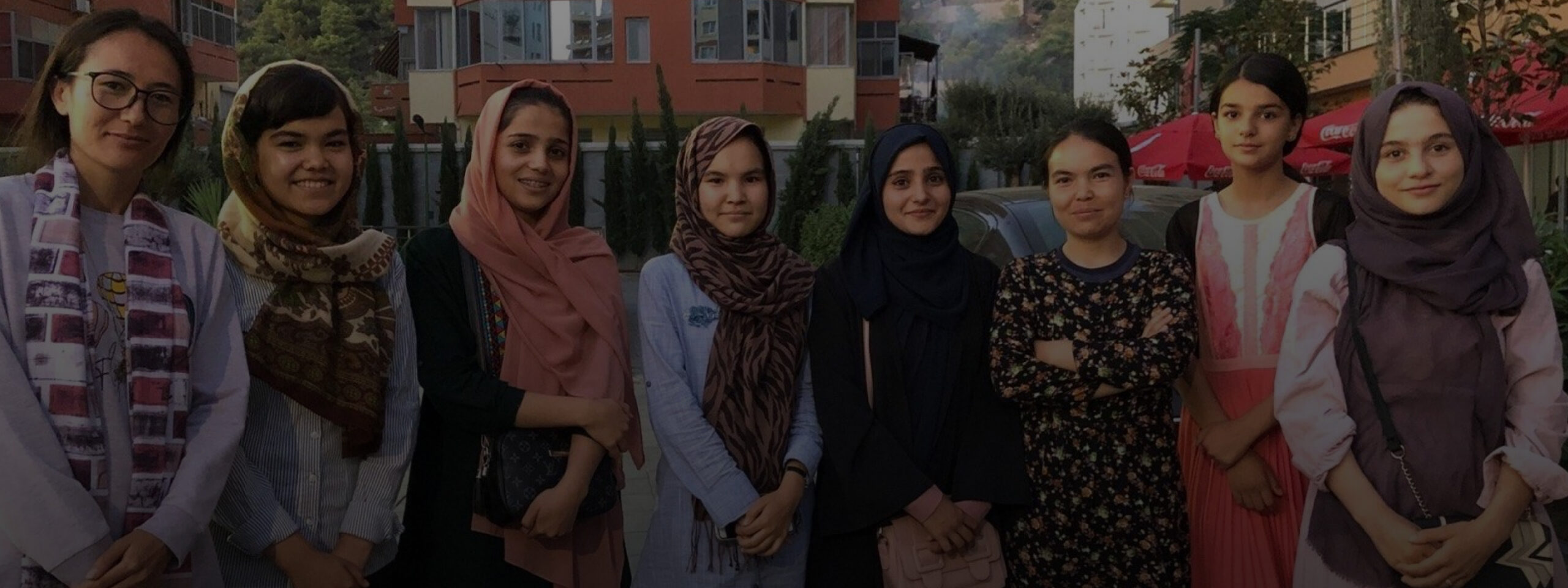Group of women with headscarves posing for camera